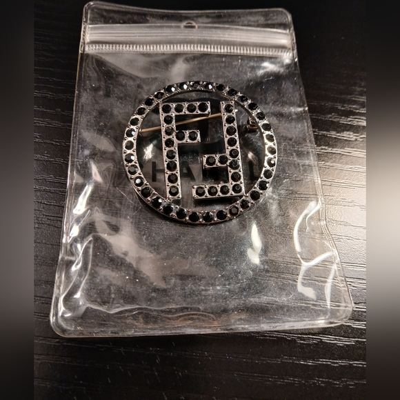 Black Studded Logo Brooch. - Picture 2 of 2